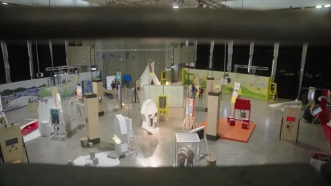 Interior of Creative Event Venue With Booths and Attendees, Professional Setup Stock Footage 301539859
