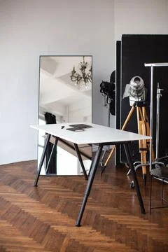 The interior of the creative workshop. Table and mirror. Stock Photos