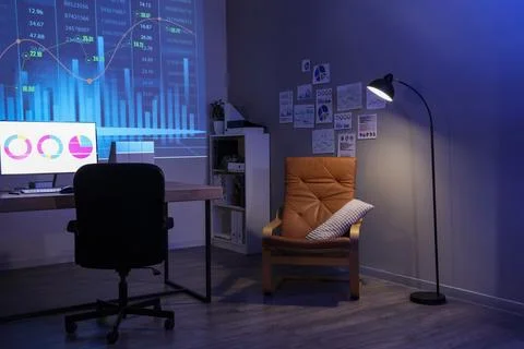 Interior of dark data scientist's office with workplace, glowing lamp and pro Stock Photos