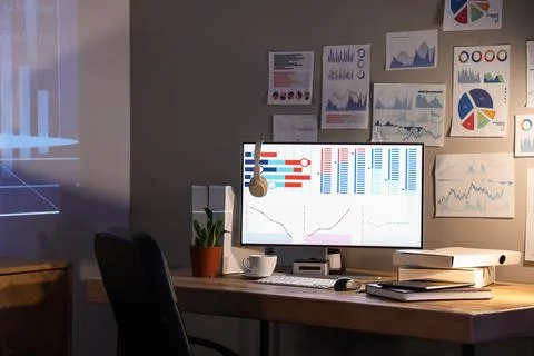 Interior of dark data scientist's office with workplace and projector screen Stock Photos