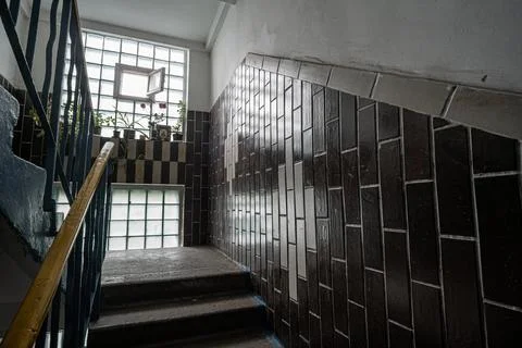 Interior of a dark staircase case of an old Soviet panel house Stock-Fotos