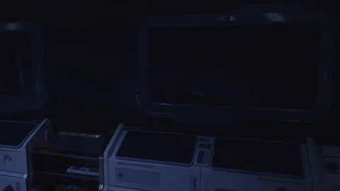 Interior of a darkened control room showcasing advanced technology and screens Stock Footage 304468706