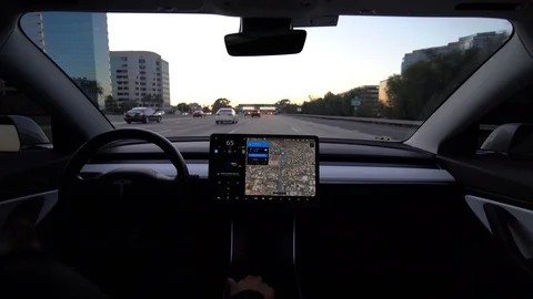 Interior dashboard view of autonomous car or EV in full self driving autopilot Stock Footage 118802948