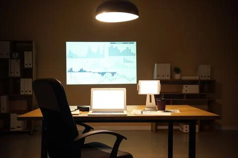 Interior of data scientist's office with workplace, shelving units, documents Stock Photos
