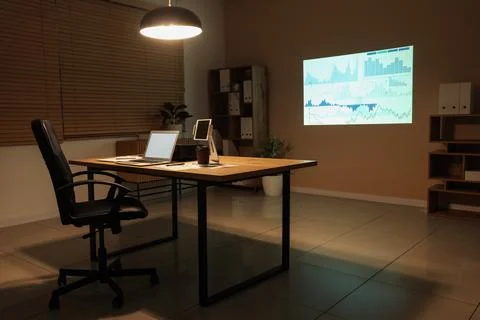 Interior of data scientist's office with workplace, shelving units, documents Stock Photos