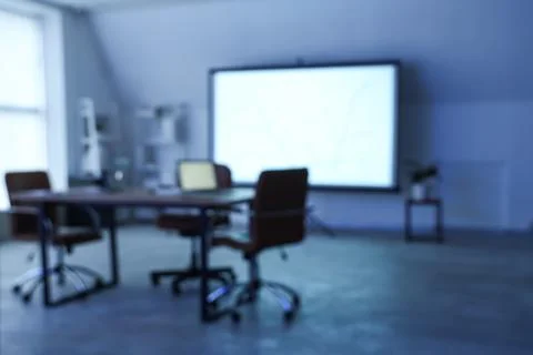 Interior of data scientist's office with workplace, laptops and diagrams on p Stock Photos