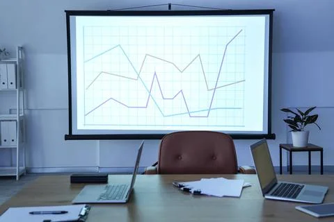 Interior of data scientist's office with workplace, laptops, documents and di Stock Photos