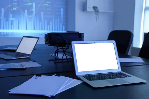 Interior of data scientists office with workplace, laptops, documents and dia Stock Photos