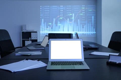 Interior of data scientist's office with workplace, laptops, documents and di Stock Photos