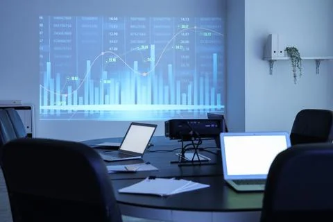 Interior of data scientist's office with workplace, laptops, documents and di Stock Photos