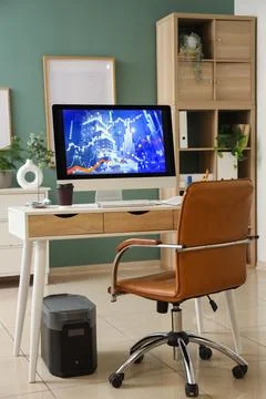 Interior of data scientist's office with workplace and shelf unit Foto stock