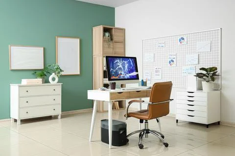 Interior of data scientist's office with workplace, pin board and diagrams Stock Photos