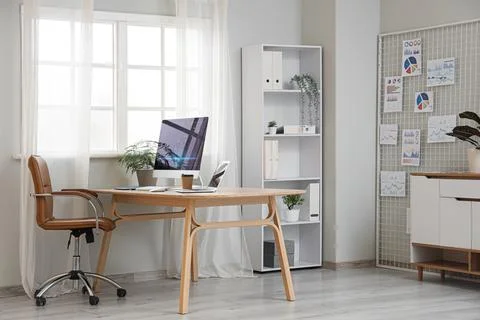 Interior of data scientist's office with workplace, pin board and diagrams Stock Photos