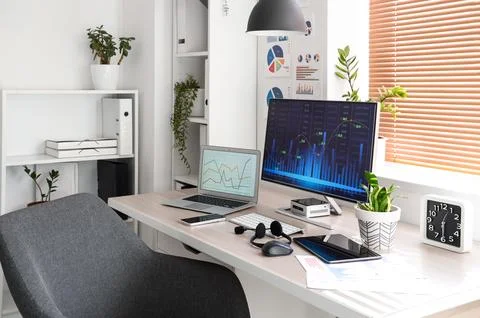 Interior of data scientist's office with workplace and shelf units Stock Photos