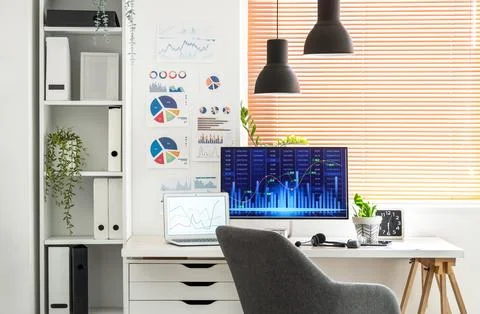 Interior of data scientist's office with workplace and shelf unit Foto stock