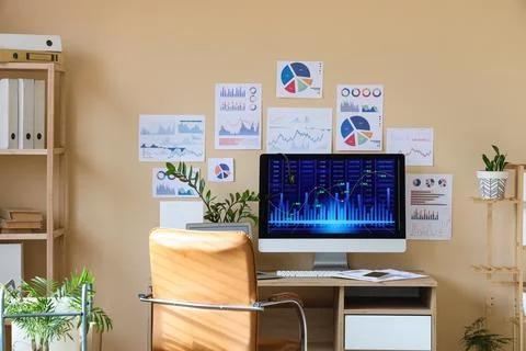 Interior of data scientist's office with workplace and diagrams Stock Photos