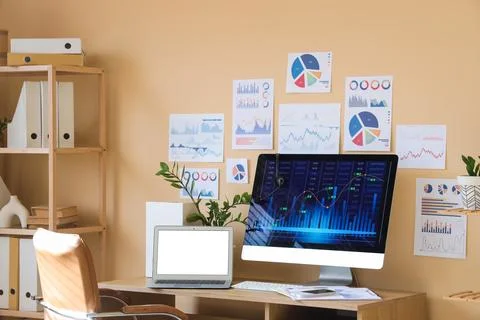 Interior of data scientist's office with workplace and diagrams Stock Photos