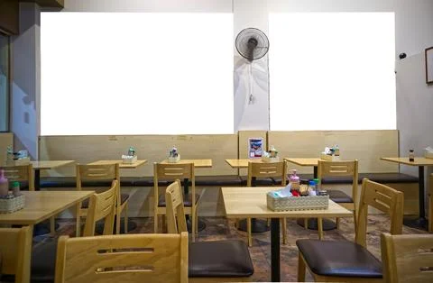Interior decorating with tables chairs with empty pictures on the wall 스톡 사진