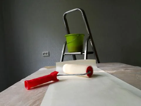 Interior decorating with wallpaper process and tools Stock Photos