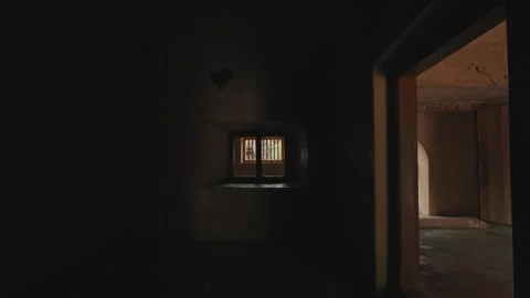 Interior of a deserted historic stone room with light coming through a window Stock Footage 332418613