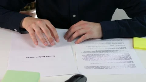 An interior design contract that is reviewed by a manager or lawyer before Stock Footage 312732536