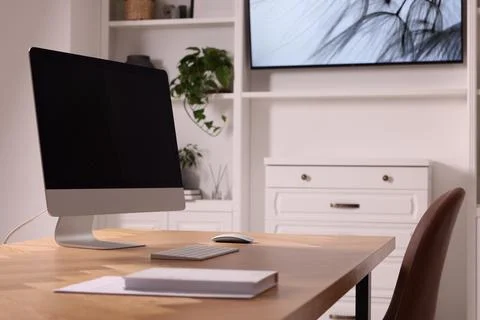 Interior design. Cosy workplace with computer near tv area Foto stock