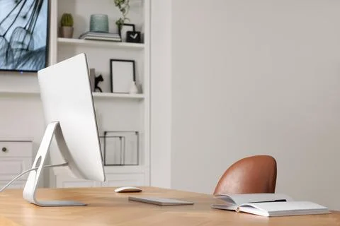 Interior design. Cosy workplace with computer near tv area. Space for text Foto stock