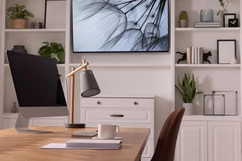 Interior design. Cosy workplace with computer near tv area Foto stock