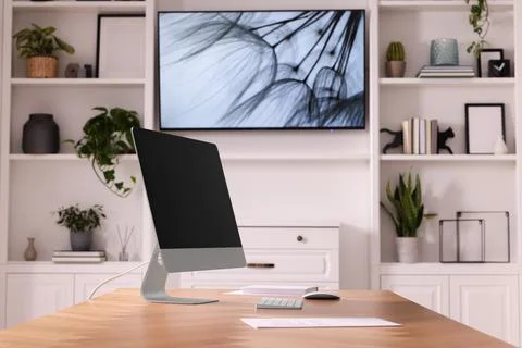 Interior design. Cosy workplace with computer near tv area Foto stock