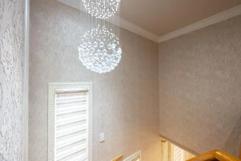 Interior design featuring decorative lighting, textured walls, and patterne.. 스톡 사진