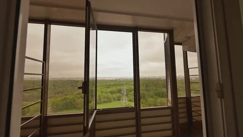Interior design with large windows overlooking the green massif of the city Stock Footage 80872725