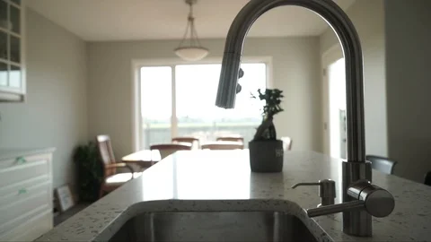 Interior design of modern kitchen featuring faucet and big picture window Stockbeeldmateriaal 127460318