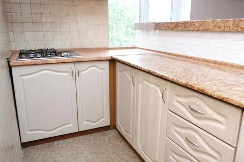 Interior design of modern narrow smart compact kitchen with white contempor.. Foto stock