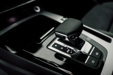 Interior Design of New Car. Automatic gearbox and media controller close up Foto stock