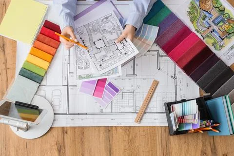 Interior design project planning with architectural blueprint, fabric swatche Stock Photos