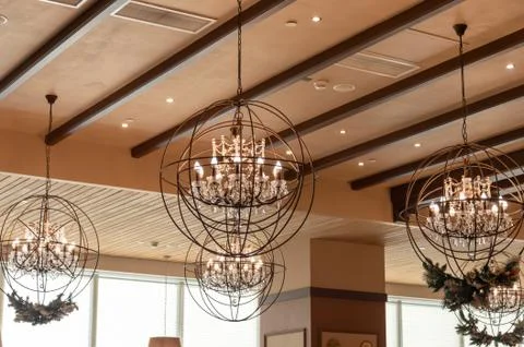 Interior design round lamp frame in cafe. Lighting lamp under the ceiling. In Stock Photos