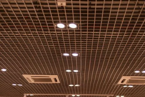 Interior design in shades of brown: slatted ceiling with intermittent beams Stock Photos