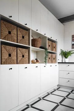 Interior design, storage unit with wicker baskets. Stock Photos