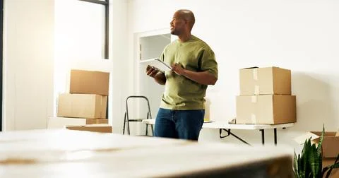 Interior design, tablet and thinking with black man in new house for diy pr.. Stock Photos