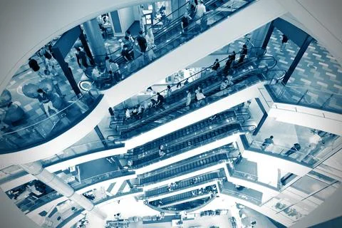Interior design of Terminal 21 Shopping Mall with people on escalator at Asoke Ilustración de archivo