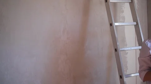 Interior designer in the apartment is making note for preparing renovation Stock Footage 127340475