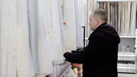 Interior designer consulting textile samples, touching fabric swatches Stock Footage 341289082