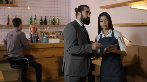 Interior designer discussing project with customer Stock Footage 100683541