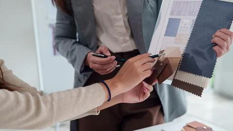 Interior Designer Hands Choosing Material Swatches for Home Renovation Proj.. Stock Photos