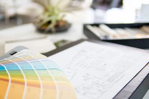 Interior designer s working table, an architectural plan of the house, a c... Stock Photos