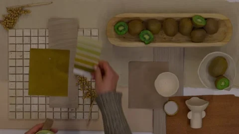 Interior designer selecting green and earthy color swatches for natural mood boa Stock Footage 329827426