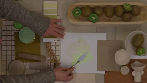 Interior designer selecting green and earthy color swatches for natural mood boa Stock Footage 329827512
