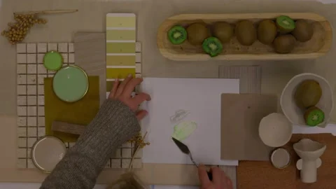 Interior designer selecting green and earthy color swatches for natural mood boa Stock Footage 329827562