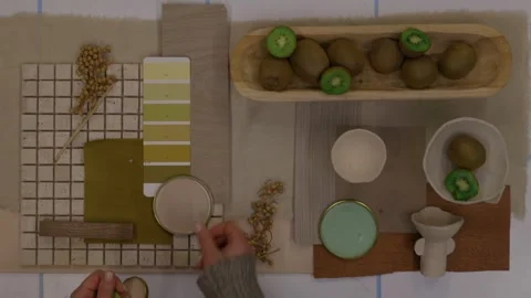 Interior designer selecting green and earthy color swatches for natural mood boa Stock Footage 329827583