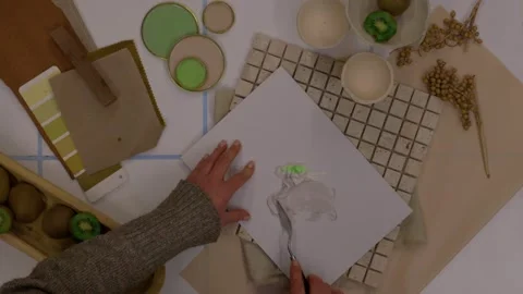 Interior designer selecting green and earthy color swatches for natural mood boa Stock Footage 329827678